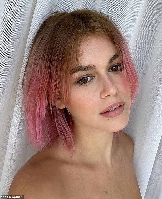 The daughter of top model Cindy Crawford, Kaia Gerber (pictured), dyed her brown locks light pink