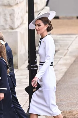 Catherine Princess of Wales Trooping The Colour, London, UK - 15 Jun 2024 Catherine Princess of Wales arriving at Trooping The Colour white dress and hat and little black purse in hand