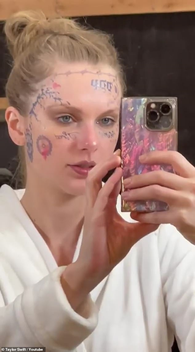 She additionally included BTS moments from the Fortnight music video, such as the songstress taking a selfie to show the fake tattoos on her face