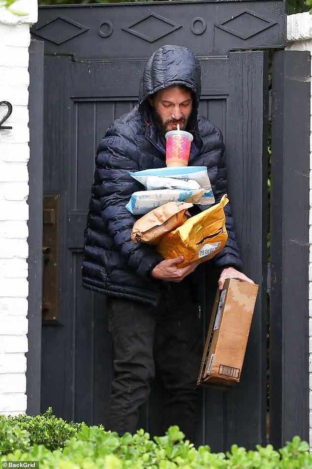 Juggling a drink from his beloved Dunkin Donuts with several parcels, Ben's ubiquity as a meme has become one of his big claims to fame