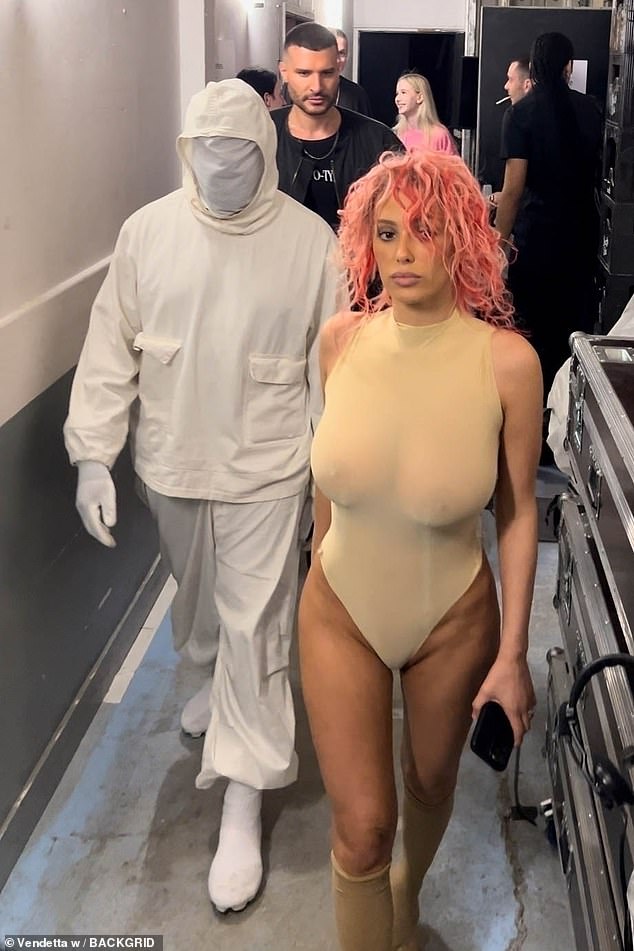 Kanye West's wife Bianca Censori showed off her eye-catching new pink hairstyle as she and the rapper unveiled another bizarre look at the PROTOTYPES Menswear show on Wednesday