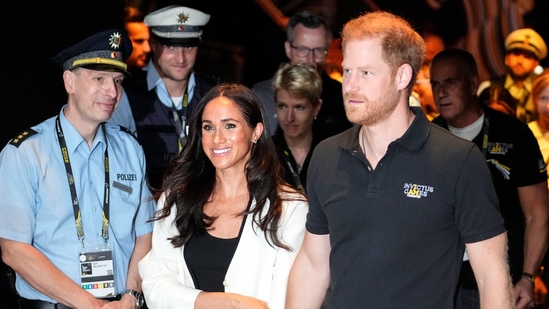 FILE - Britain's Prince Harry, right, and Meghan, Duchess of Sussex, arrive to a wheelchair basketball match at the Invictus Games in Duesseldorf, Germany, Sept. 13, 2023. Prince Harry and his wife, Meghan, will visit Nigeria in May 2024 for talks on the Invictus Games, which he founded to aid the rehabilitation of wounded and sick servicemembers and veterans, a Nigerian official said Sunday, April 28, 2024. (AP Photo/Martin Meissner, File)(AP)