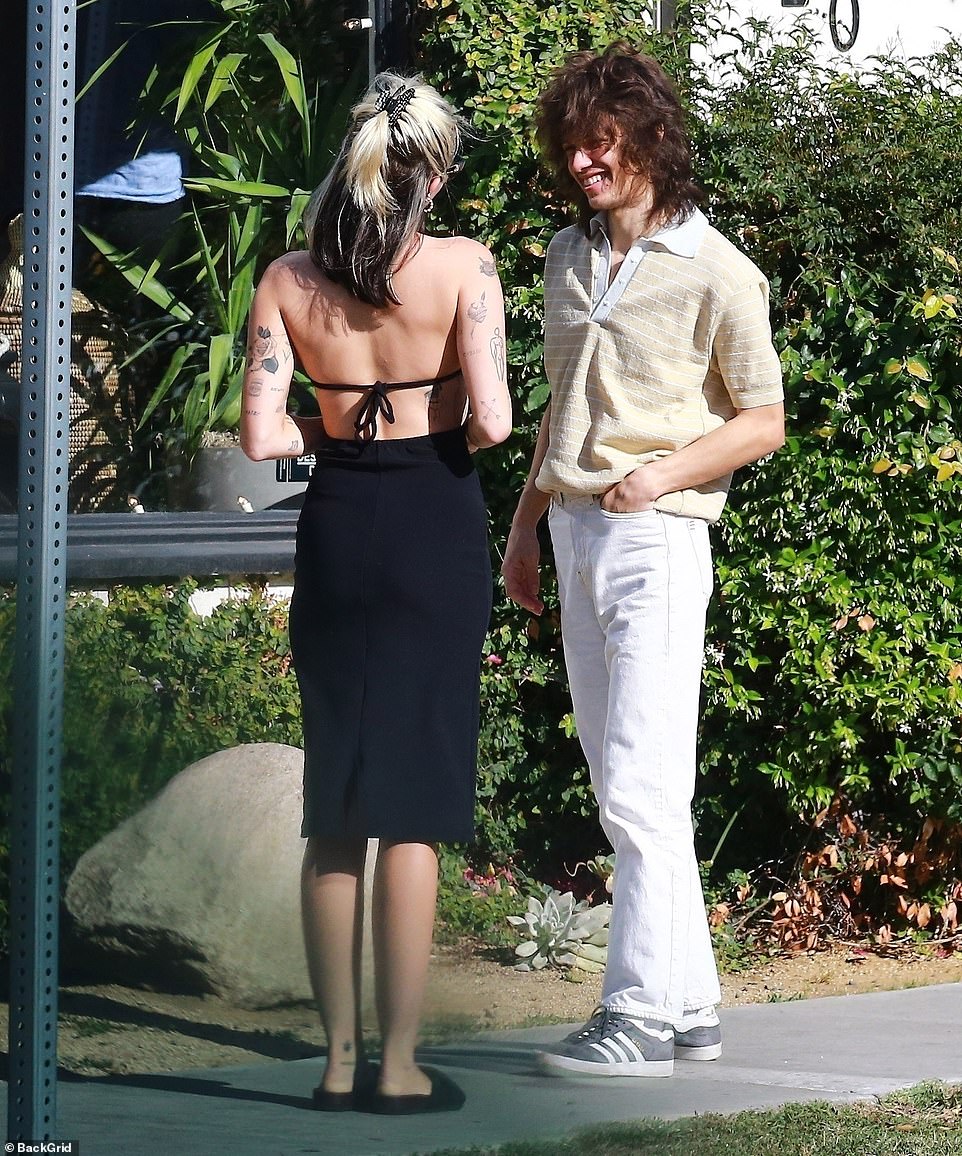 Romantic outing: Miley and her boyfriend — who plays drums for the band Liily and previously played with the Regrettes — couldn't contain their passion, and they stopped multiple times for an embrace and kisses