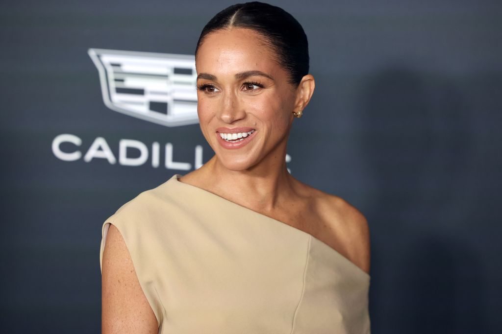 Meghan Markle in a tan dress