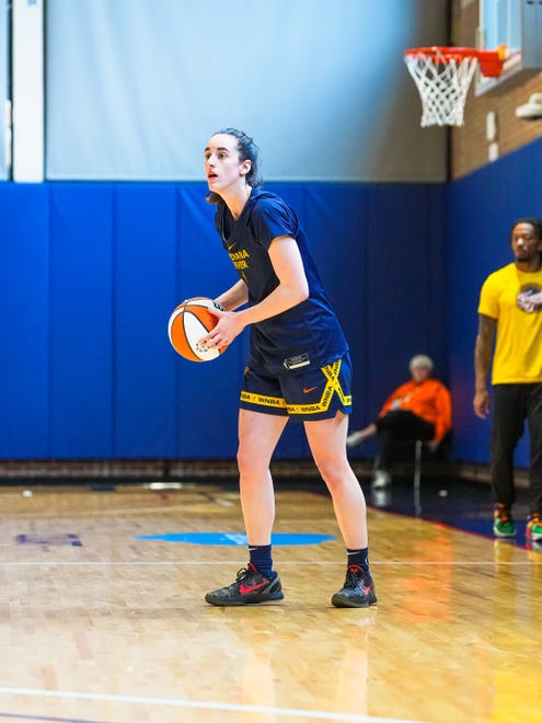 No. 1 overall draft pick Caitlin Clark looks to pass during practice at training camp April 29, 2024.