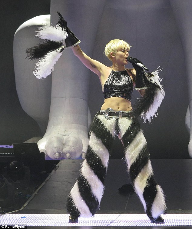 Where did she get those? The singer was sporting a pair of furry baggy trousers which she teamed with a halter neck top