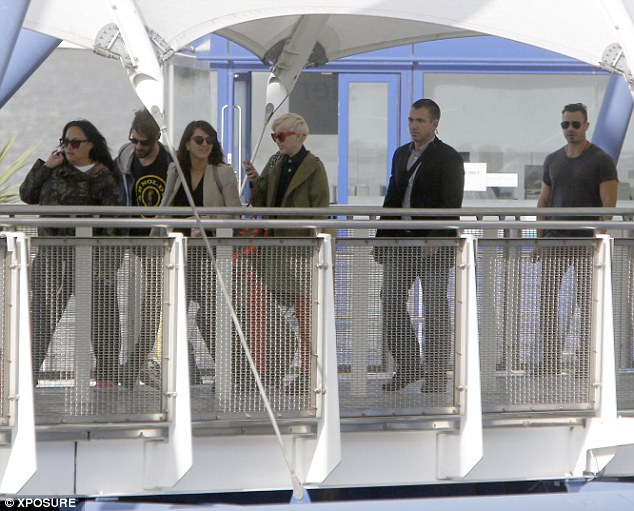 Entourage: Miley and her team travelled by boat to the arena on Tuesday