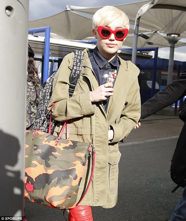 Off she goes: Miley Cyrus takes a boat to The O2 arena ahead of her first London show