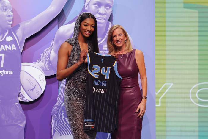 Apr 15, 2024; Brooklyn, NY, USA; Angel Reese poses with WNBA commissioner Cathy Engelbert after she is selected with the number seven overall pick to the Chicago Sky n the 2024 WNBA Draft at Brooklyn Academy of Music. Mandatory Credit: Brad Penner-USA TODAY Sports