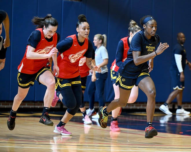 Caitlin Clark (left), Leilani Correa (center) and Maya Caldwell (right) run through drills at Indiana Fever training camp, April 28, 2024.