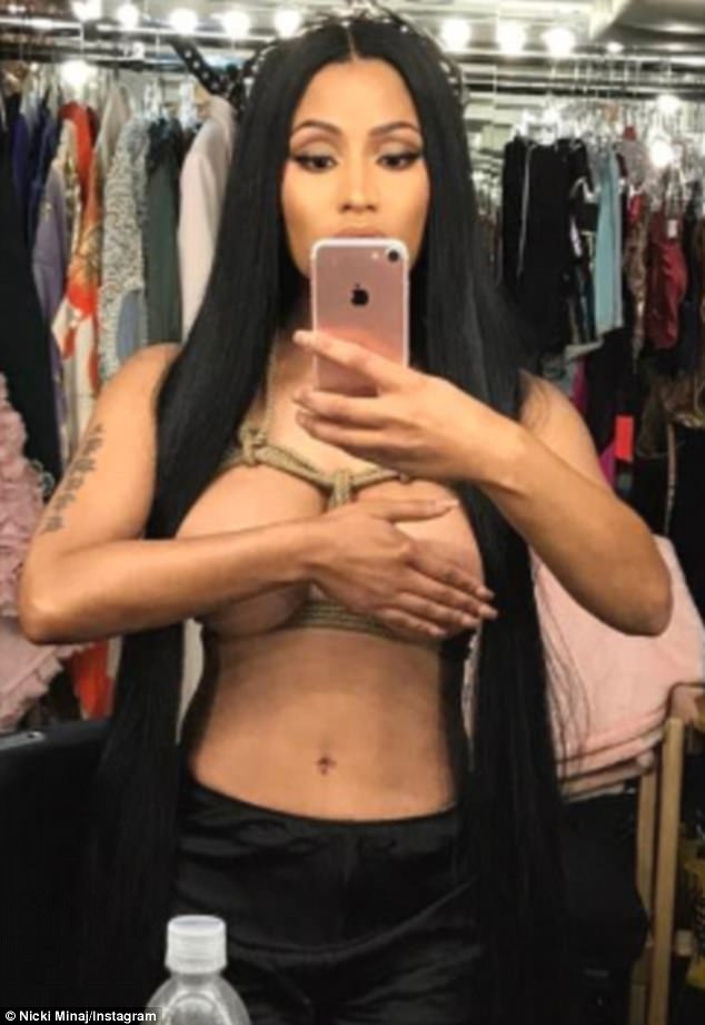 Easter honey: Nicki Minaj wished her fans a happy feast day by posing a topless snap on Instagram on Sunday