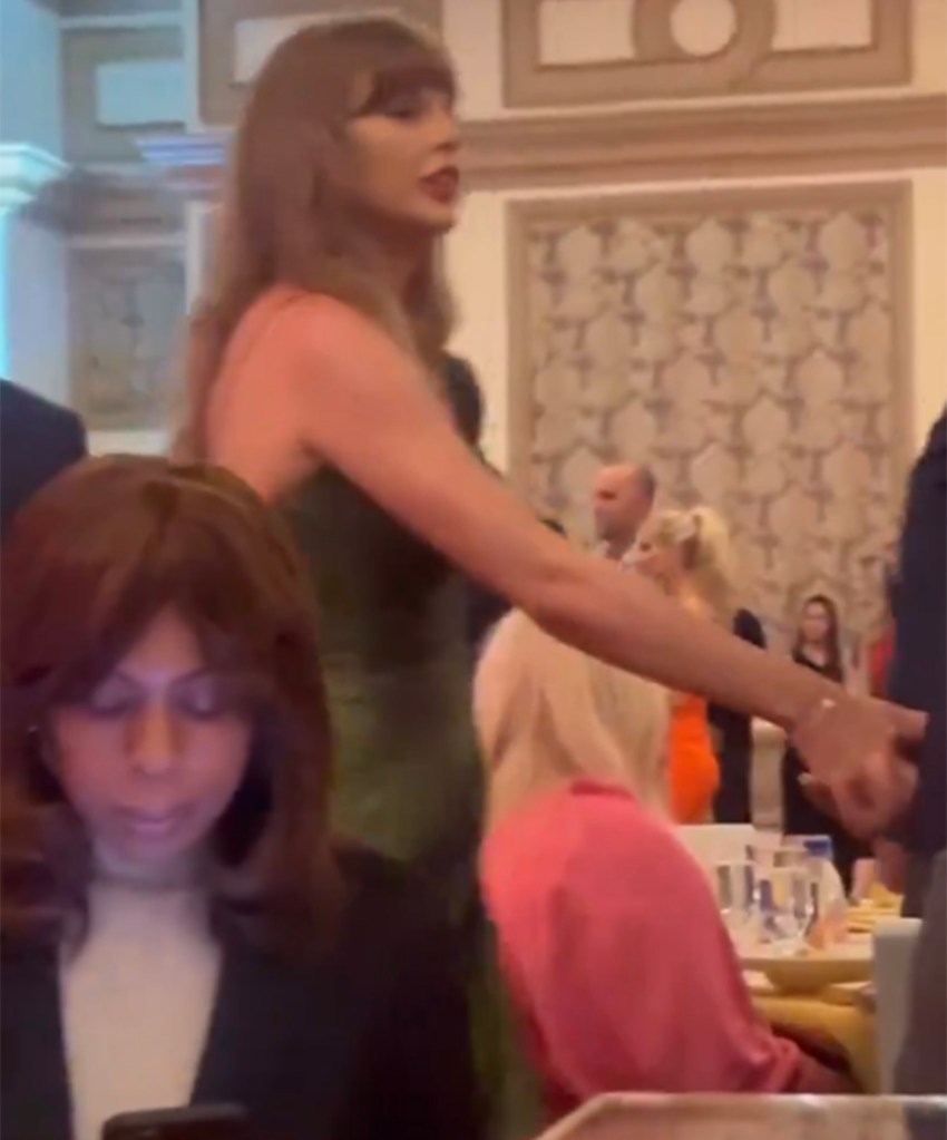 Taylor Swift is seen holding Travis Kelce's hand during the charity gala in Las Vegas.