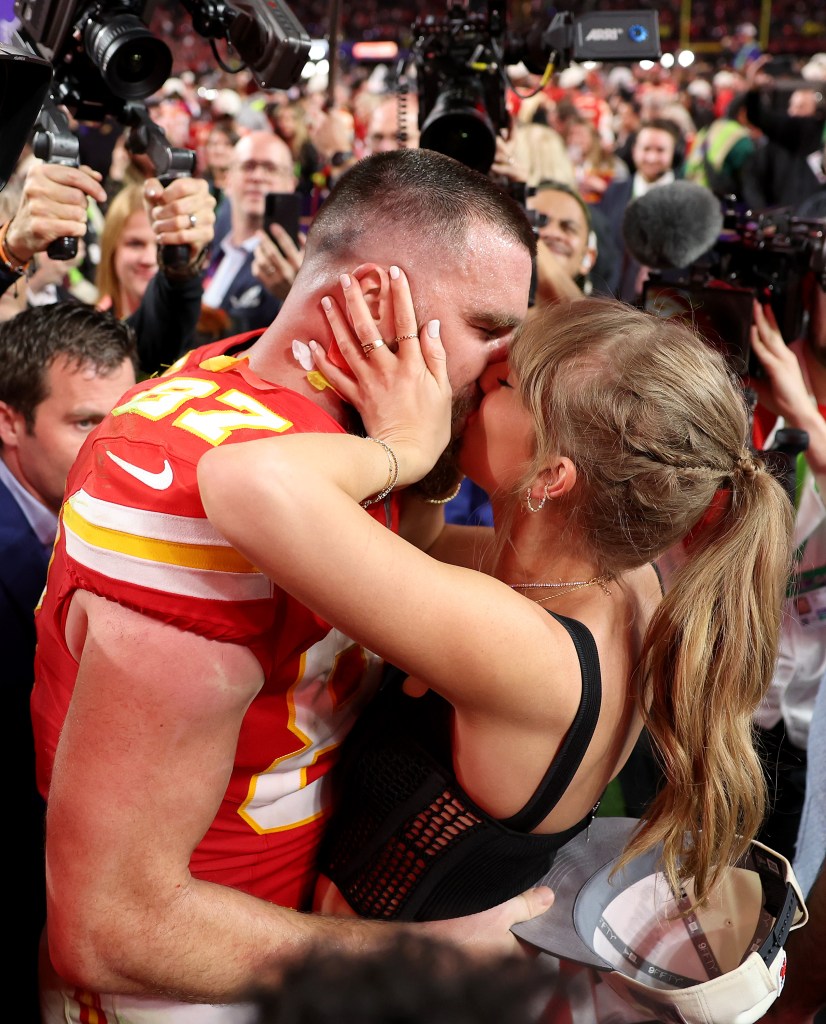 Travis Kelce and Taylor Swift kiss after the Chiefs' Super Bowl win in February 2024.