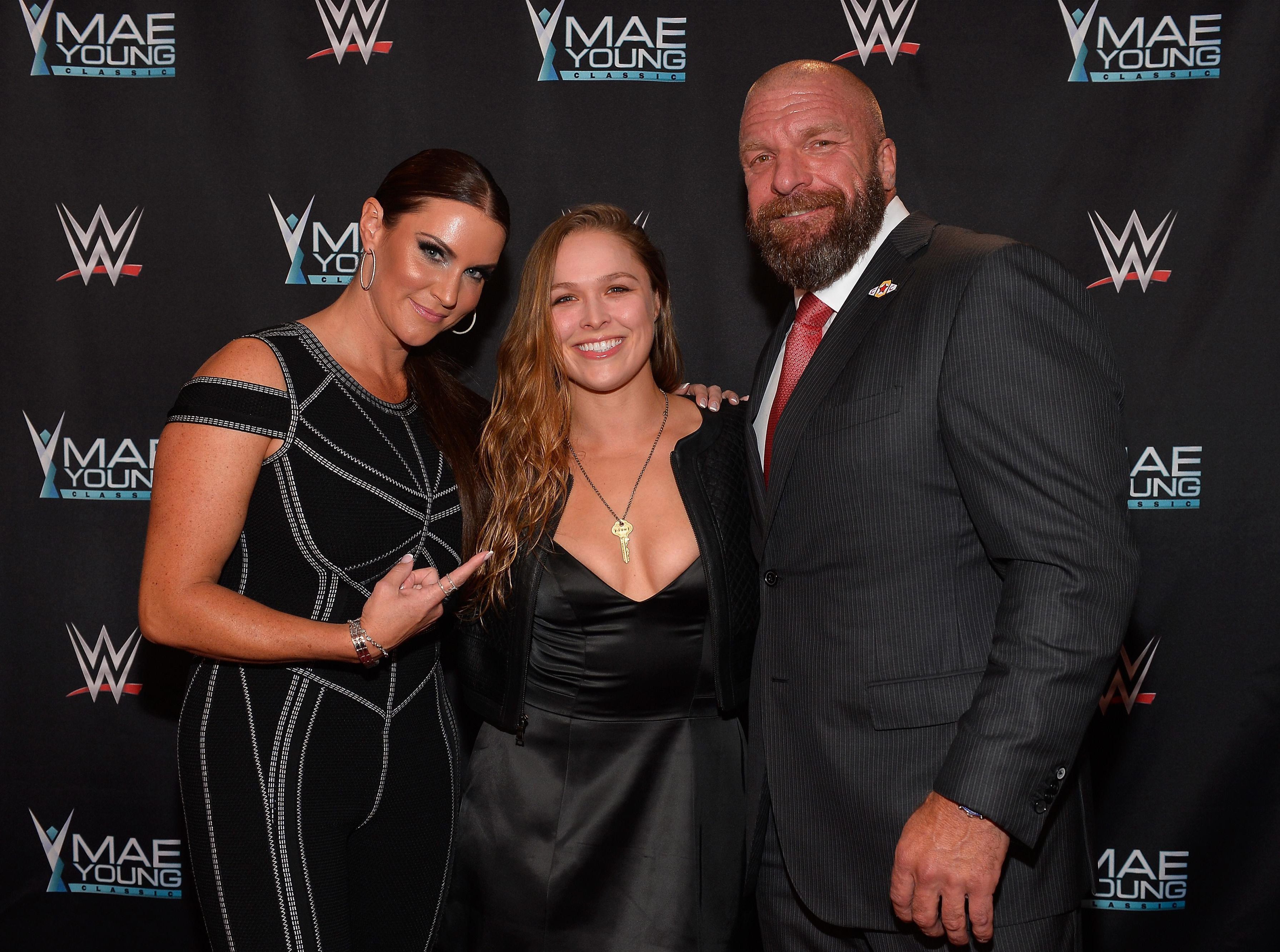  WWE chiefs Stephanie McMahon (left) and Triple H (right) say their offer to Ronda Rousey still stands