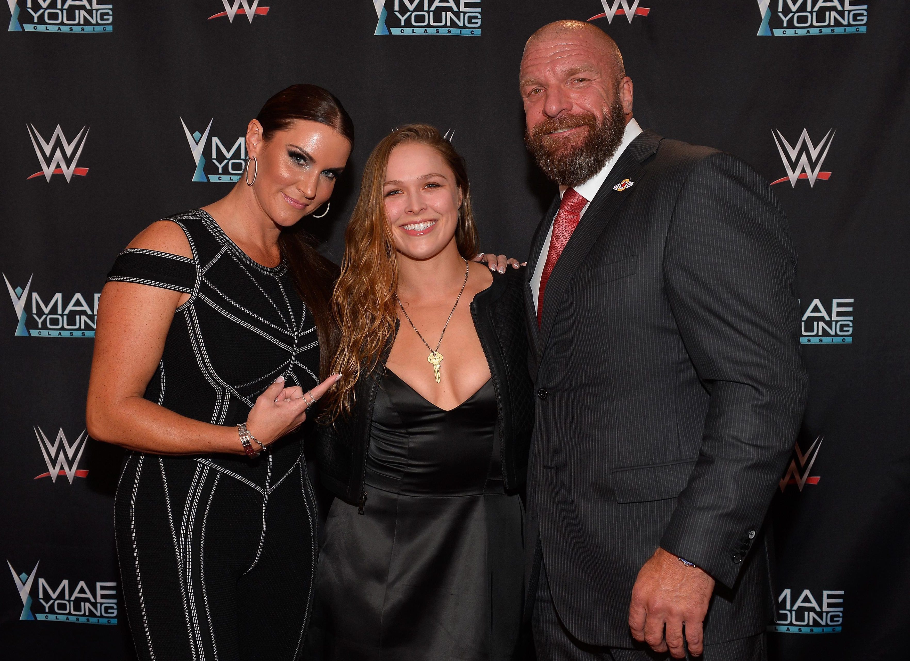  Ronda Rousey pictured with WWE chiefs Stephanie McMahon and Triple H