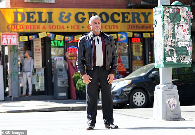 Ready for his close-up: His greying locks were combed to the side as he sported a grizzled goatee