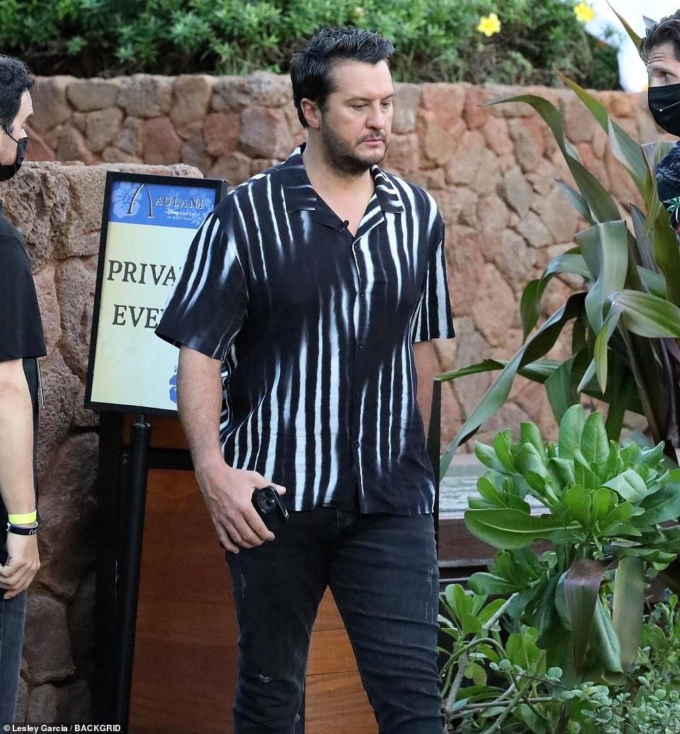 Jovial: Bryan looked jovial as he worked with Katy on set, after the cast travelled to the lavish Disney Aulani Resort for filming