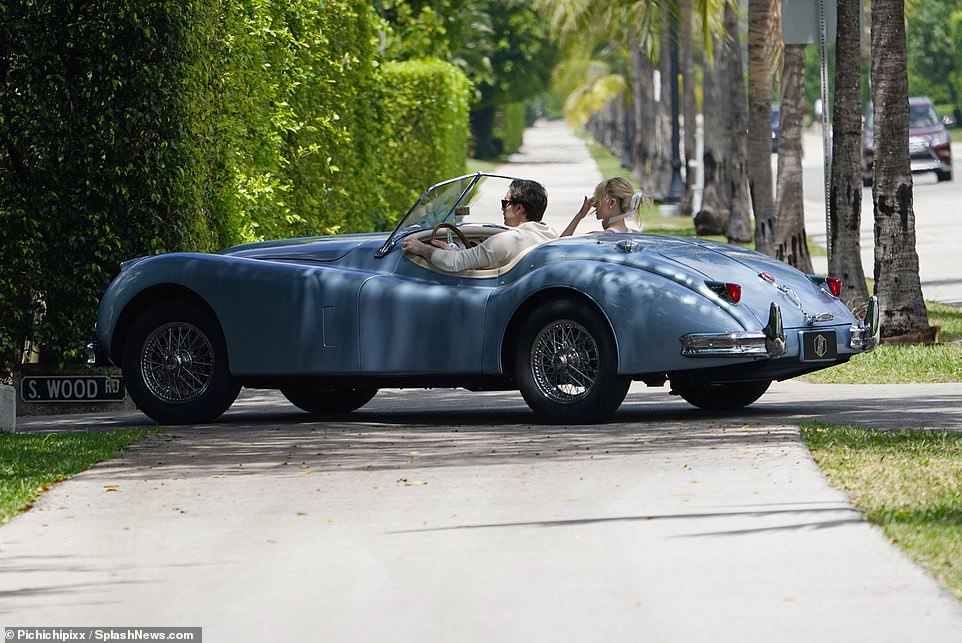 Emerging: Newlyweds Brooklyn Beckham and Nicola Peltz were pictured for the first time since $3.5m wedding as they joined his parents David and Victoria for lavish Sunday brunch in a classic convertible in Palm Beach