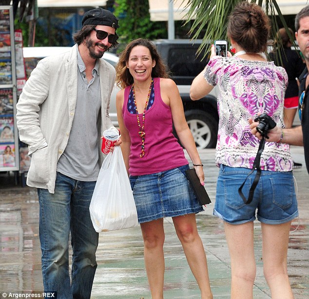 Busy exploring: Keanu was clearly enjoying a spot of sightseeing in the South American town, and happily had his picture taken with a fan