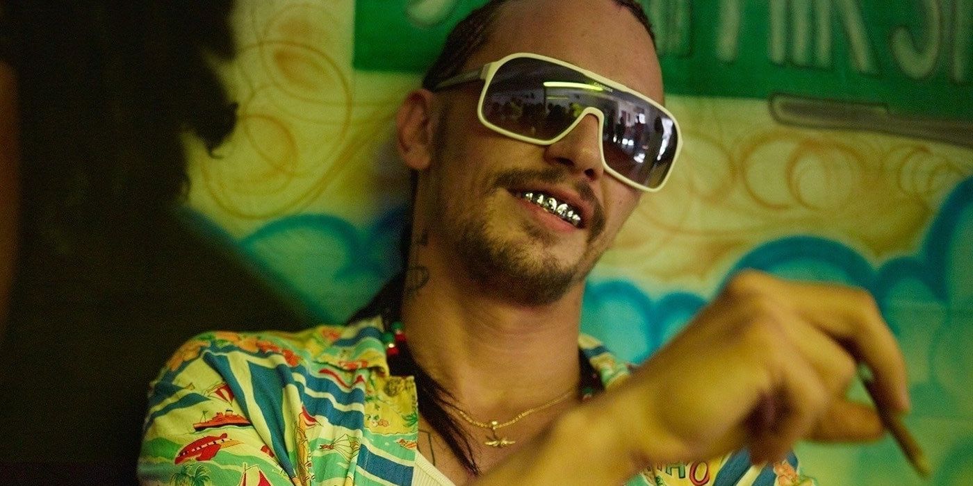 James Franco as Alien wearing glasses, smoking and smiling in Spring Breakers