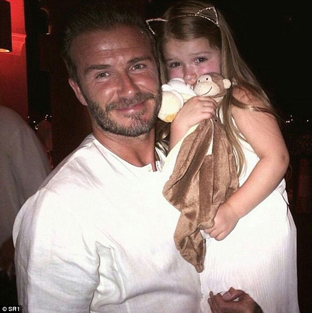 Pictured is former Manchester United and Real Madrid midfielder David Beckham with his daughter Harper in 2015