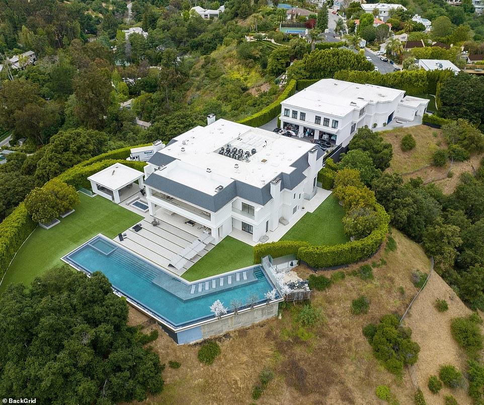 Here is a look at Lopez's spread. A zero edge pool is located behind the main house and overlooks the canyon below. The pool is about three times larger than the average pool