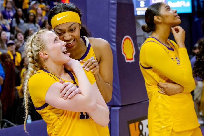 Mar 3, 2024; Baton Rouge, Louisiana, USA; LSU Lady Tigers guard Hailey Van Lith, left, and LSU Lady Tigers forward Angel Reese react to a senior tribute video for them after their victory against the Kentucky Wildcats at Pete Maravich Assembly Center.