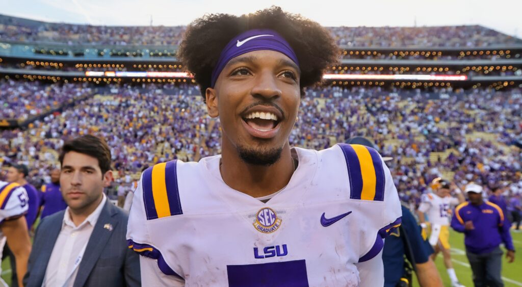 Jayden Daniels smiling in LSU uniform.