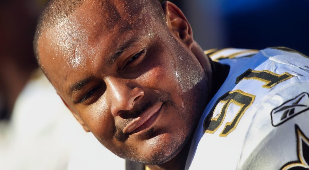 Will Smith seated on bench in uniform