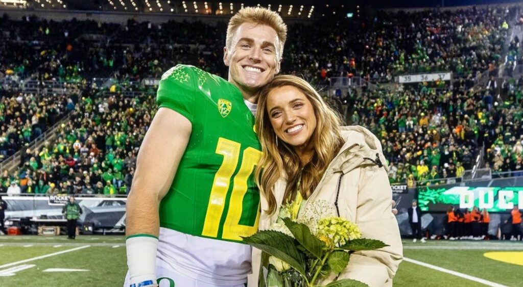 Bo Nix posing with his wife