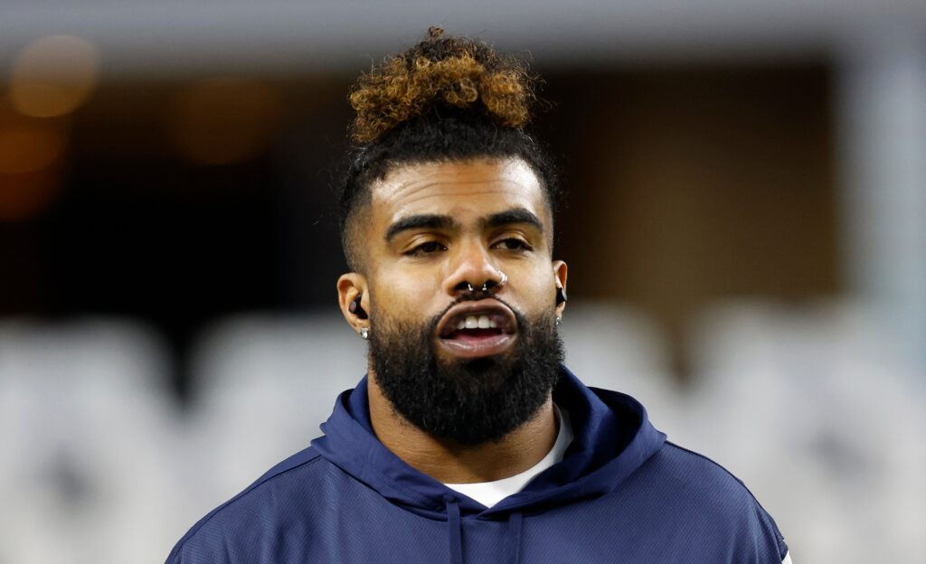 Ezekiel Elliott of Dallas Cowboys looking on.