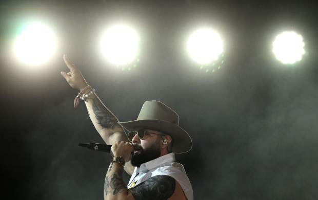 Mexican music artist Carin León performs before a packed crowd...