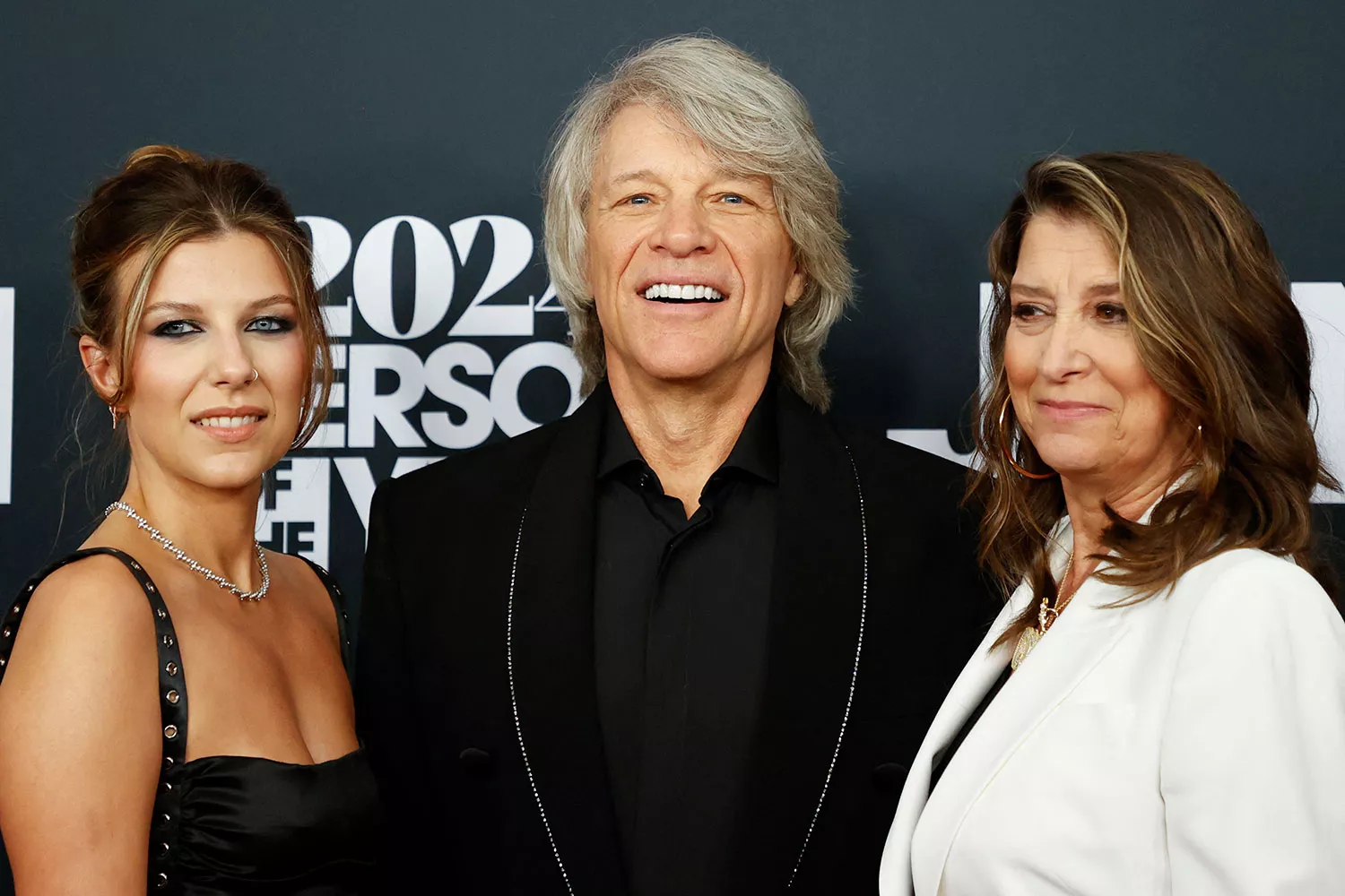 Honoree US singer-songwriter Jon Bon Jovi with his wife Dorothea Hurley (R) and daughter Stephanie Rose Bongiovi (L) attend the 2024 MusiCares Person of the Year gala at the LA Convention Center in Los Angeles, February 2, 2024. 