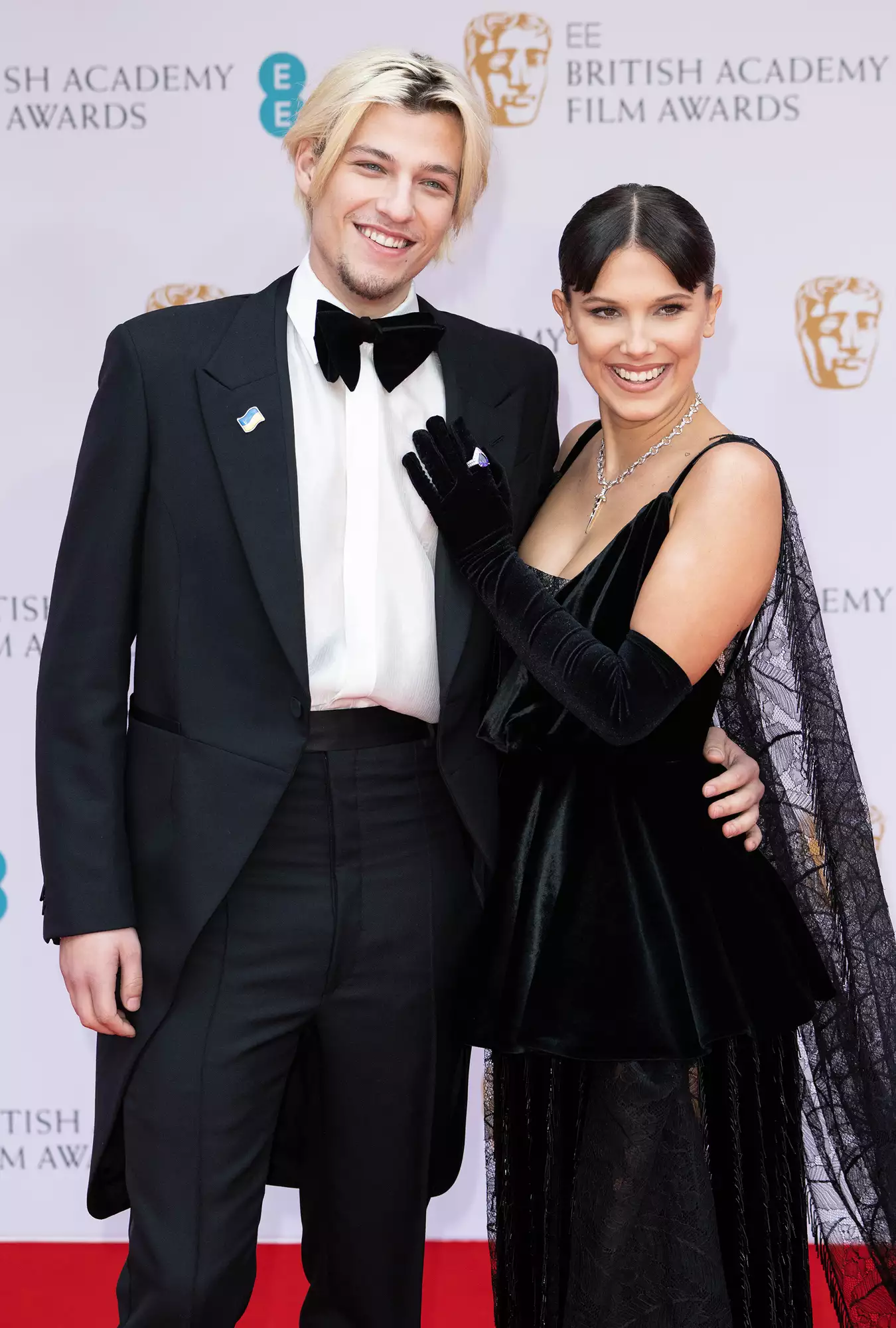 Jake Bongiovi and Millie Bobby Brown attend the EE British Academy Film Awards 2022 at Royal Albert Hall on March 13, 2022 in London, England