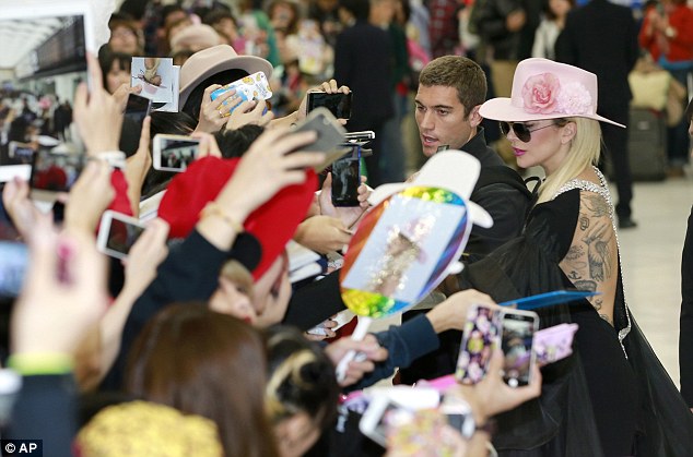 Happy to see you: The singer was greeted by a throng of jubilant devotees, whom she was quick to walk over and talk to