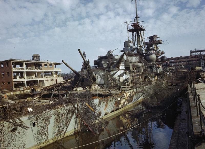 Admiral Hipper in Kiel Harbour covered in camouflage in order to hide her from Allied bombers, 19 May 1945.