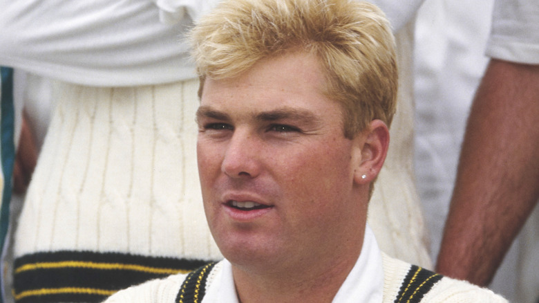 shane warne blonde squinting cricket vest