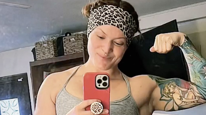 rebecca lorch flexing taking selfie