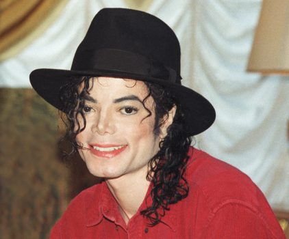 Michael Jackson poses at a press conference before a date on his HIStory world tour in 1996. (Photo by Phil Dent/Redferns)