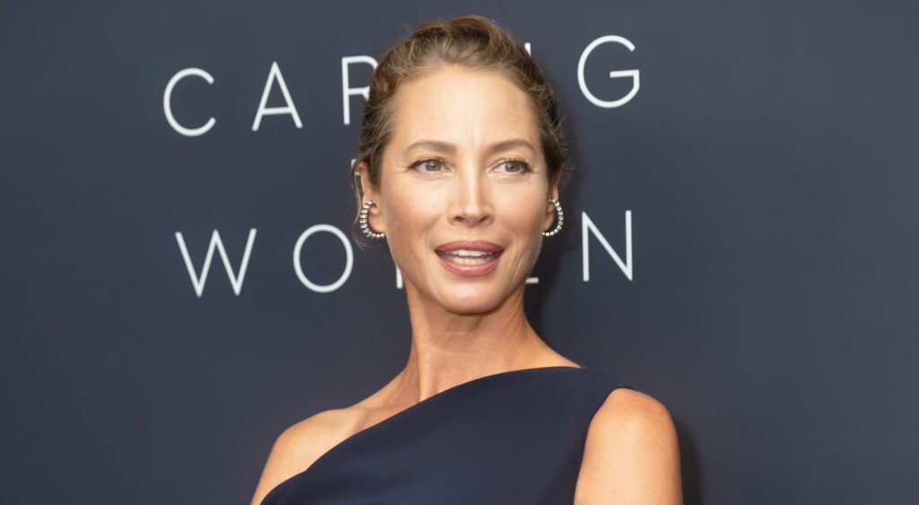 Christy Turlington posing in black dress