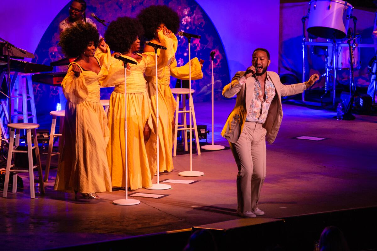 Singer John Legend performs during the Bigger Love Tour.