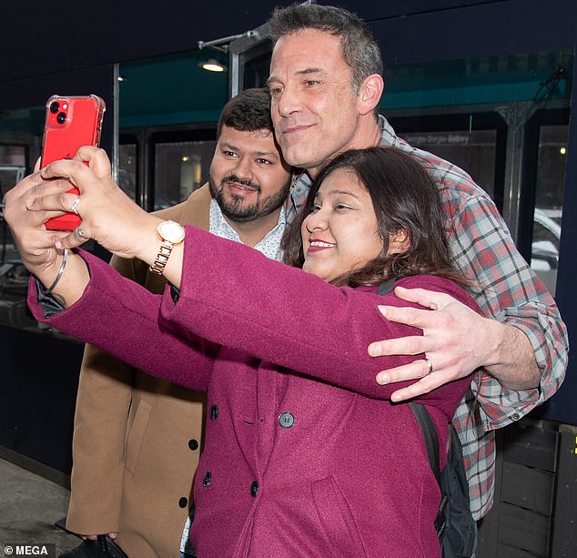 As they hoofed it down the sidewalk, Ben paused to graciously stand for pictures with a couple of fans who had approached him