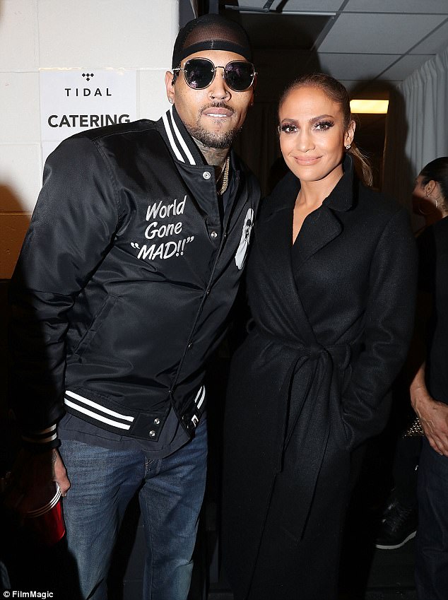 Side by side: Jennifer posed for a backstage photo with fellow singer Chris Brown 