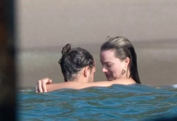 Margot and Tom enjoyed a dip in the water during their beach day