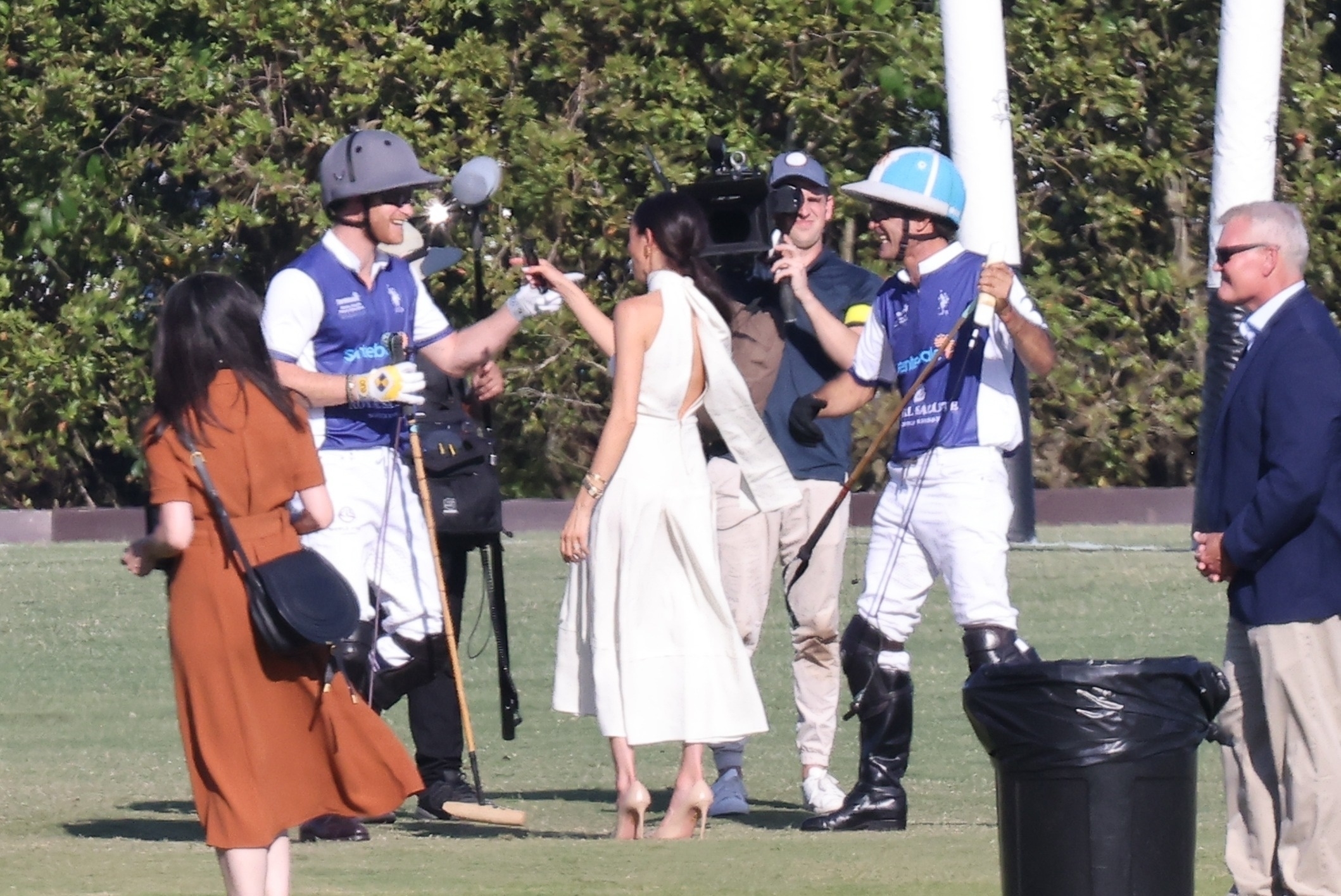 The couple were surrounded by their film crew at the Royal Salute Polo Challenge for charity Sentebale’s fundraiser in Florida