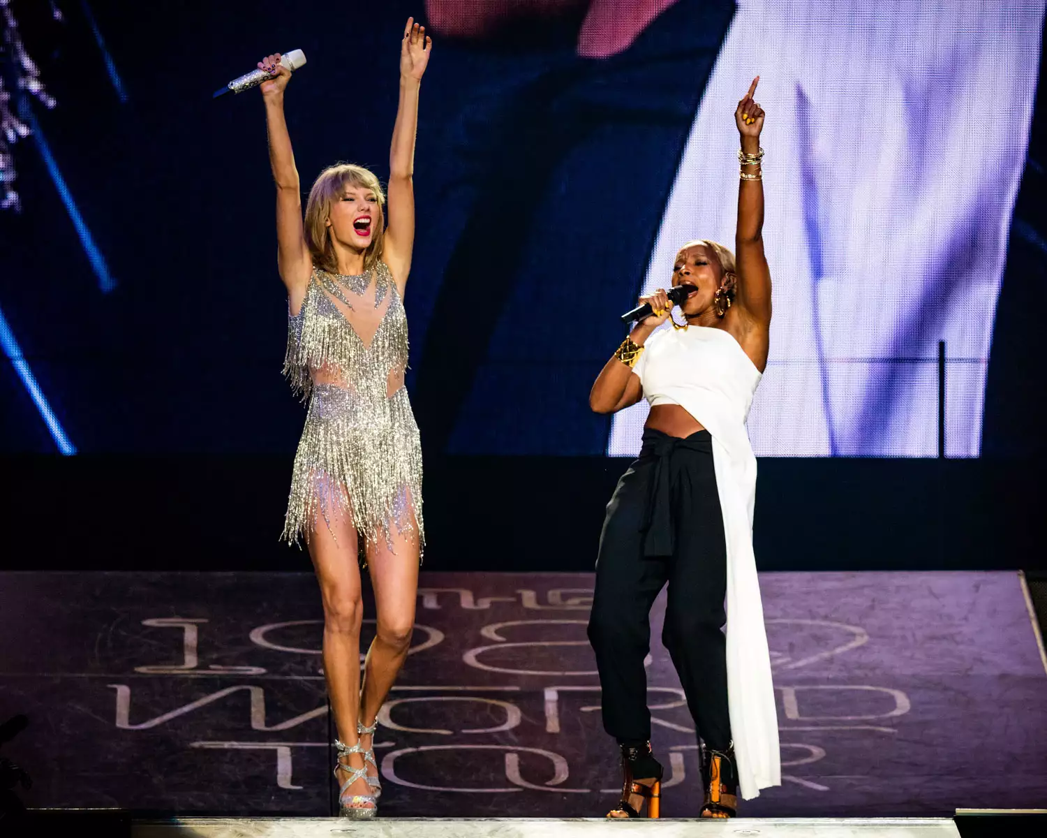 Singer-songwriters Taylor Swift (L) and Mary J. Blige perform onstage during Taylor Swift The 1989 World Tour Live In Los Angeles at Staples Center on August 22, 2015