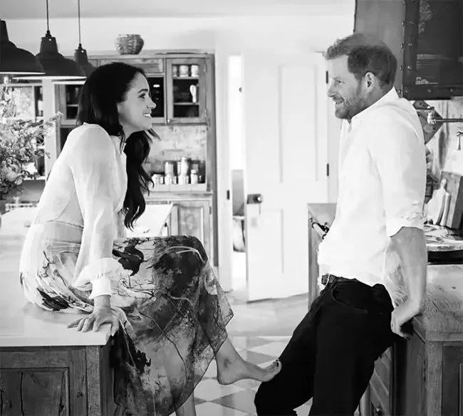 We've seen casual Meghan barefoot sitting on the kitchen counter at Frogmore Cottage