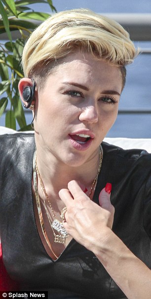 Feeling hot: Miley is animated and pulls a variety of expressions despite feeling uncomfortable