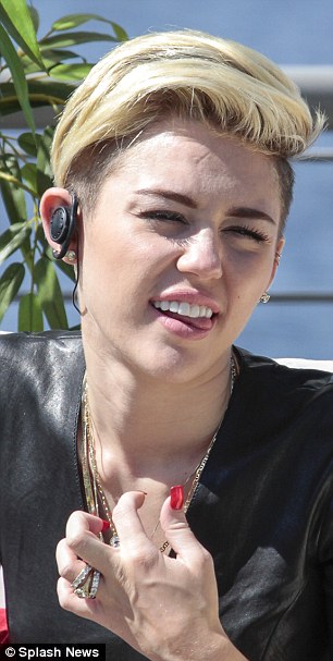 Feeling hot: Miley is animated and pulls a variety of expressions despite feeling uncomfortable