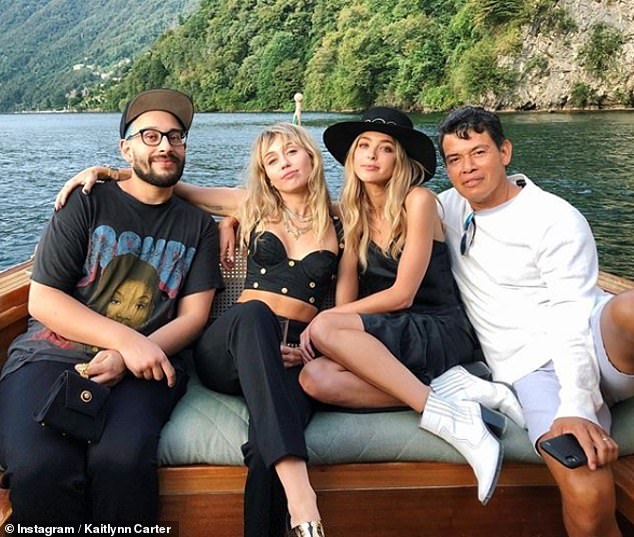 Italian getaway: The pair have been joined on the getaway by a host of pals (pictured with Eyewear designer Bradley Kenneth and Pilates instructor Saul Choza)